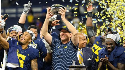 Michigan coach Jim Harbaugh tells team he will serve a three-game suspension to start this season, AP sources say